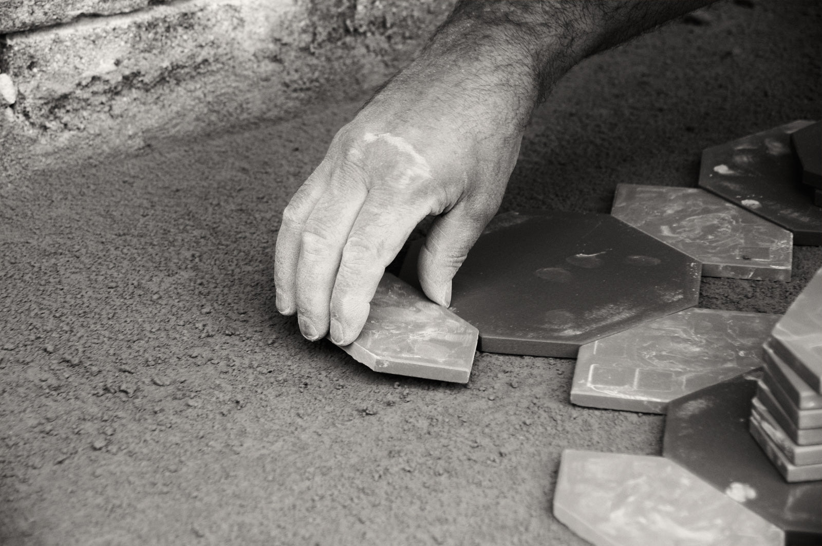 Tessellated Tiler laying tiles in Sydney